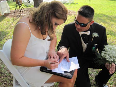 Witnesses signing the marriage license at Black Diamond Ranch Country Club wedding ceremony Witnesses signing the marriage license at Black Diamond Ranch Country Club wedding ceremony